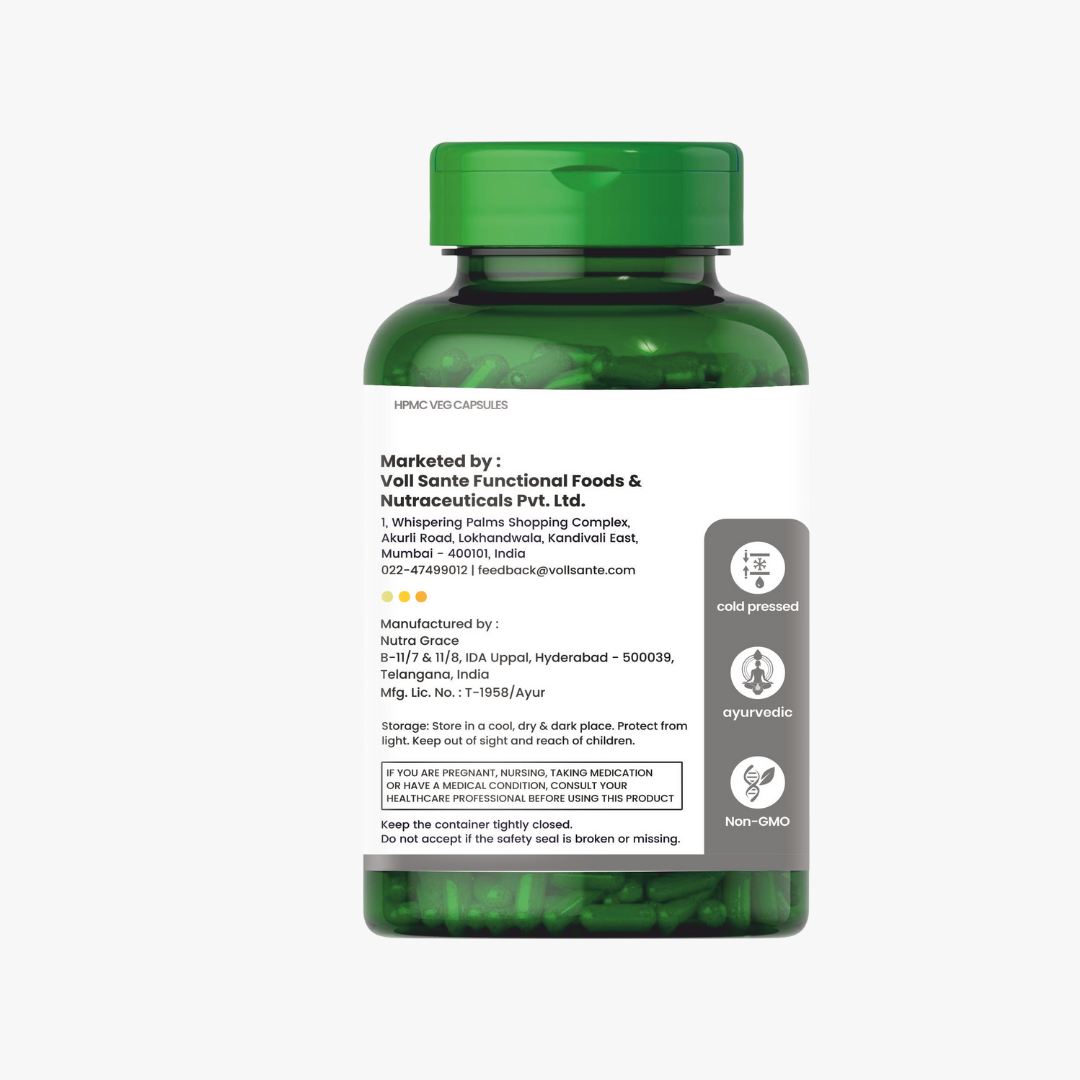 Black seed oil bottle and capsule close-up